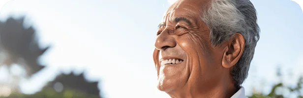 Smiling older man enjoying a confident, active day outdoors